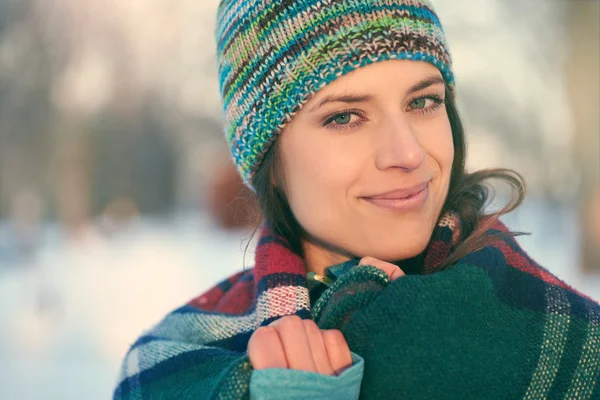 Attractive mixed race woman smilling in the snow — Stock Photo, Image