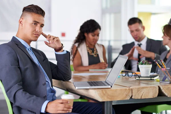 team of successful business people having a meeting in executive sunlit office