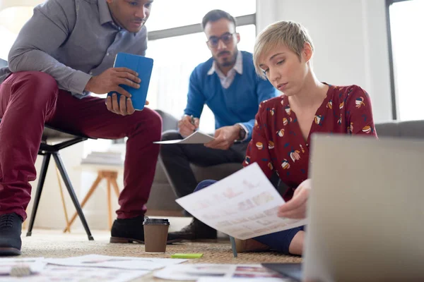 Multi-ethnic team of creative millenials collaborating on a brainstorm project — Stock Photo, Image