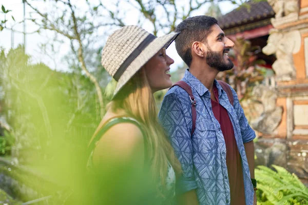 Two young people visiting temple ruins in southeast Asia during — Stock Photo, Image