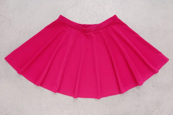Pink bell-bottomed is isolated,  skirt has crimson colour — Stock Photo, Image