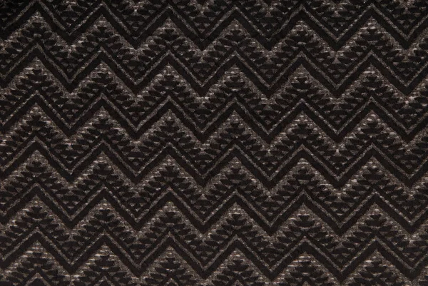 Black knitted fabric with grey pattern — Stock Photo, Image