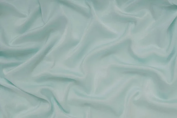 Material de cetim turquesa claro, tecido de cetim azul, tecido de seda — Fotografia de Stock