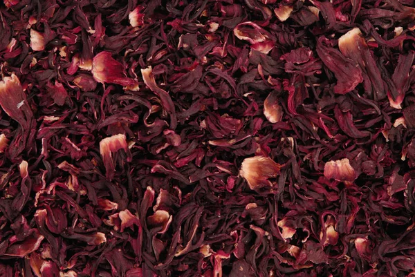 Chá carcade seco, fundo textura criativa, flores vermelhas Imagem De Stock