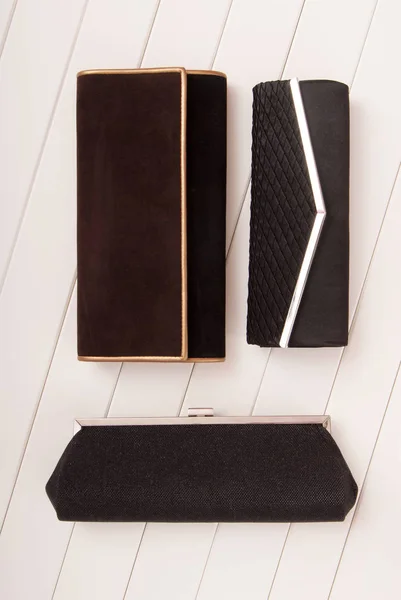 Assortment of clutchs, elegance black handbags, black and brown — Stock Photo, Image