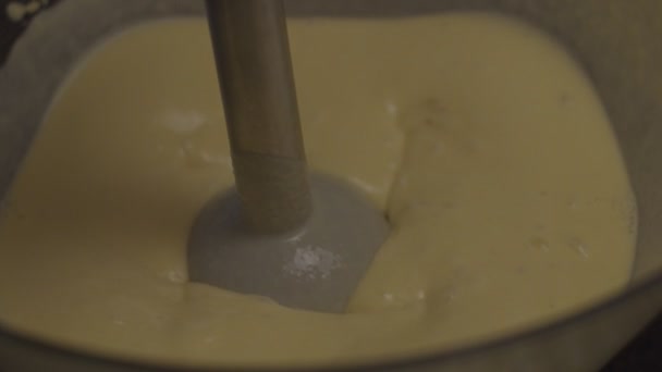 Whisking batter of gluten free flour with egg for healthy cookie in slow motion. Corn pastry with blender. — Stock Video