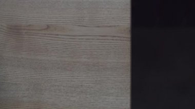 Bright ceramic plate for dishes appearing on wooden countertop surface, top view shot. 