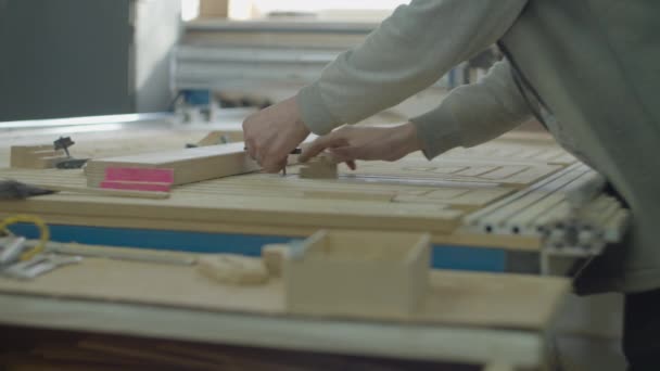 Computer numerical control machine operator preparing wood for action. Carpentry workshop processes. Wooden furniture manufacturing. — Stok video