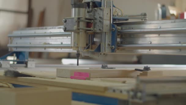 Milling process on computer numerical control machine in action in slow motion in different views. Carpentry workshop processes. Wooden furniture manufacturing. — Wideo stockowe