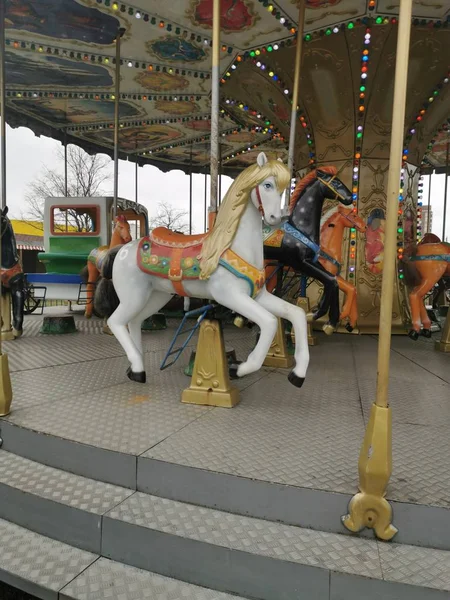 Carousel round in the Park in the spring.Horse on a roundabout.Fun, recreation, children
