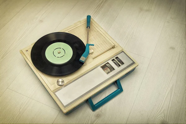 Vintage Record Player On A Wooden Surface