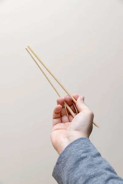 Male Hand Holding Chopsticks — Stock Photo, Image