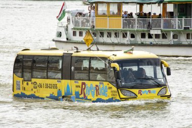 BUDAPEST, HUNGARY, JULY 9, 2015: Riverride floating bus cruising at Danube River across Budapest, the capital city of Hungary.