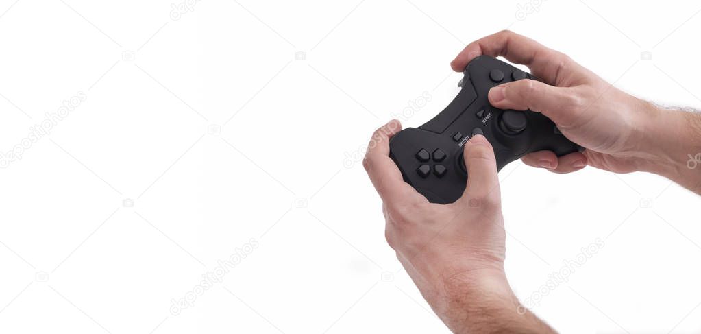 Male Hands Holding A Black Joypad, Isolated On White Background