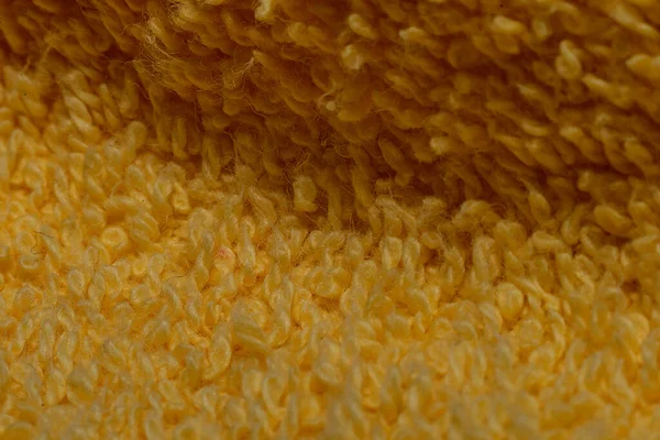 Sarı havluya yakın çekim, pamuk ipliklerinin ayrıntıları