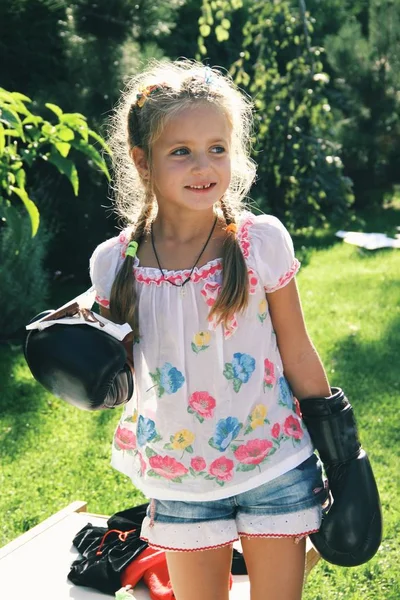Portrait of little caucasian girl wearing boxing gloves — Stock Photo, Image
