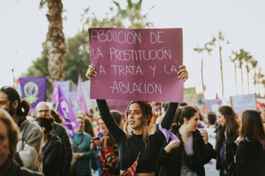 MALAGA, SPAIN - MARCH 8 th, 2020: Woman showing feminist banner during feminist strike in Malaga, Spain, on March 8 th, 2020.
