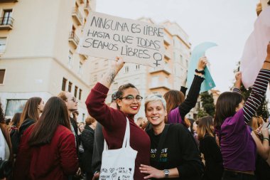 MALAGA, SPAIN - MARCH 8 th, 2020: Woman showing feminist banners during feminist strike in Malaga, Spain, on March 8 th, 2020.