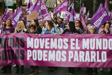MALAGA, SPAIN - MARCH 8 th, 2020: People celebrating 8m woman day with banners and placards, during feminist strike in Malaga, Spain, on March 8 th, 2020.