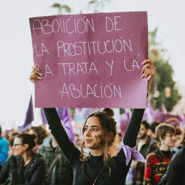 MALAGA, SPAIN - MARCH 8 th, 2020: People celebrating 8m woman day with banners and placards, during feminist strike in Malaga, Spain, on March 8 th, 2020.