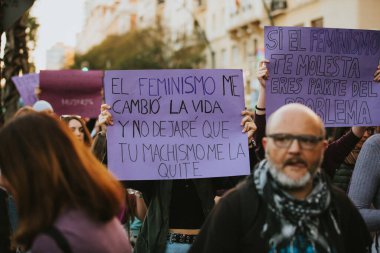 MALAGA, SPAIN - MARCH 8 th, 2020: People celebrating 8m woman day with banners and placards, during feminist strike in Malaga, Spain, on March 8 th, 2020.