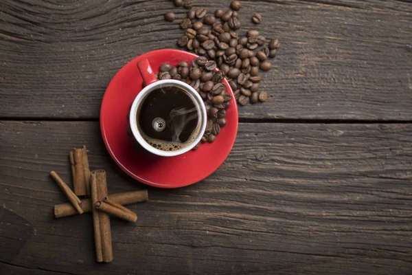 Cup of coffee with brown sugar on a wooden table — Stock Photo, Image