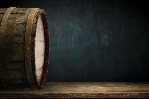 background barrel and worn old table of wood