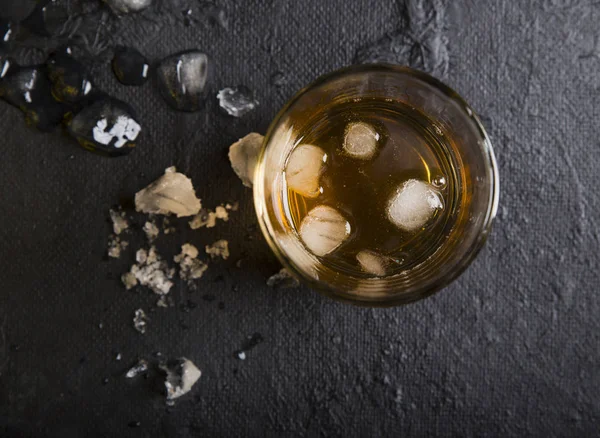 Whiskey with ice. Top view with copy space