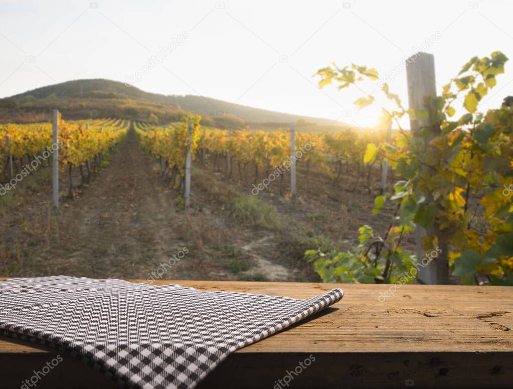 Landscape of Tuscany with desk of yellow wood