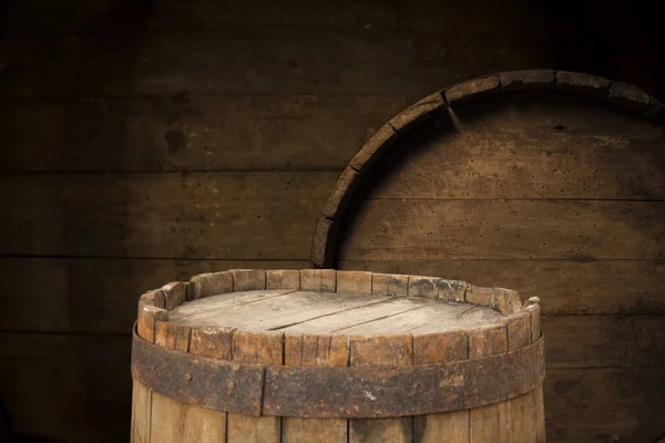 Old wooden barrel on a brown background — Stock Photo, Image