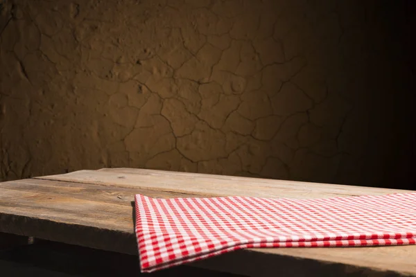 Empty wooden deck table with tablecloth over bokeh background — Stock Photo, Image