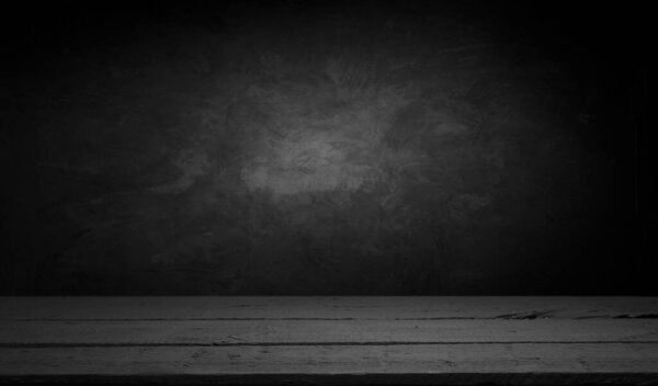 Selected focus empty brown wooden table and wall texture or old black brick wall blur background image. for your photomontage or product display