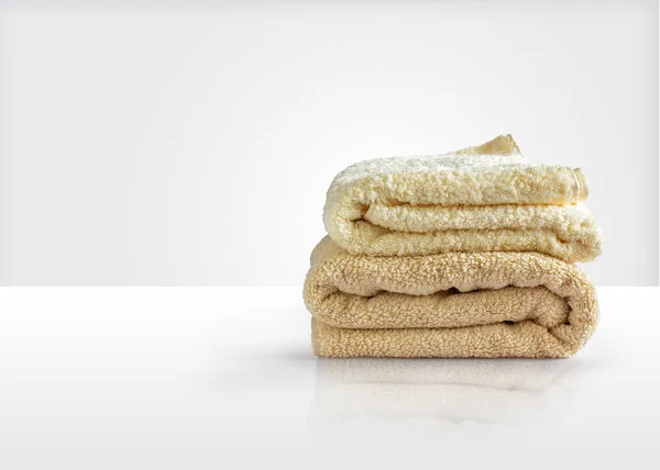 Wash towels on a white table, symbolizes the Laundry — Stock Photo, Image