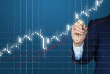 İşadamı grafik borsa analiz eder..