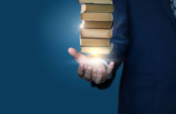 Businessman show stack of books . — Stock Photo, Image