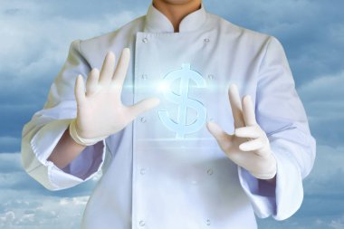 Şef Aşçı bir sembol Doları sunar..