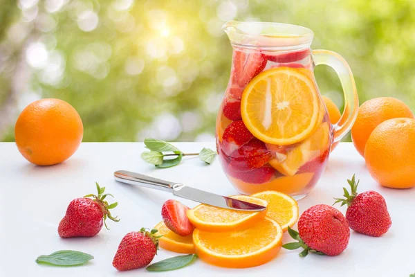 Strawberry lemonade with oranges and mint. — Stock Photo, Image