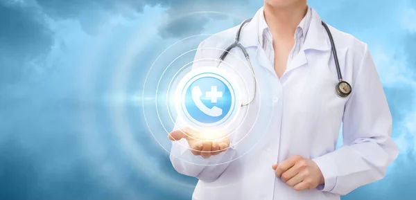 Doctor shows the icon of the medical center calls . — Stock Photo, Image