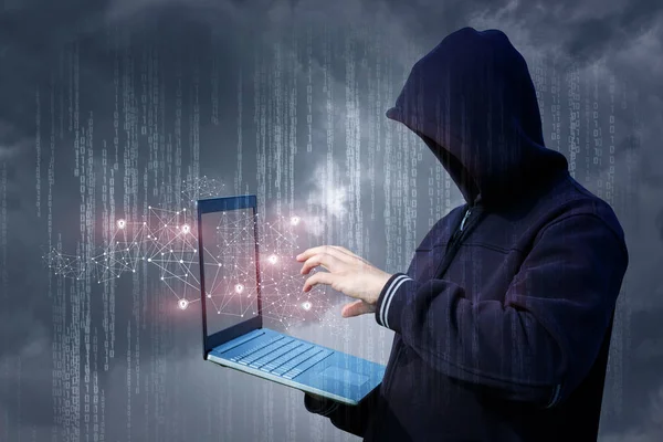 An attacker on the laptop attack a network. — Stock Photo, Image