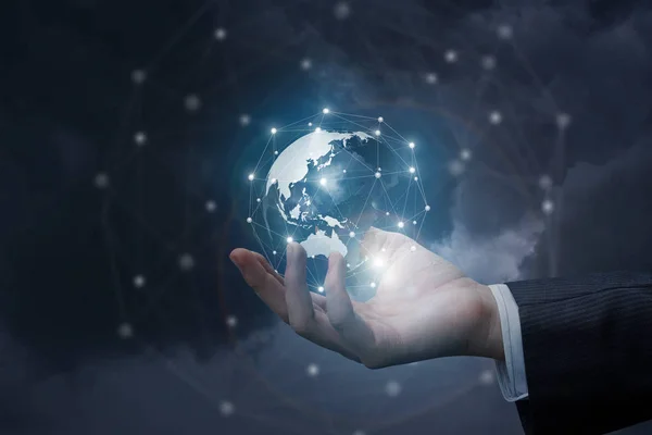 Hand of a businessman shows the global network . — Stock Photo, Image