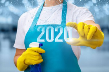 Temizlikçi kadın yeni 2020 yılını gösteriyor. .