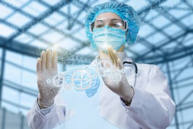 Beyin hastalıklarının tedavisi kavramı. Doktor insan beynini manipüle ediyor..