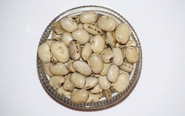 Velvet bean or Cowitch or Cowage Lacuna bean Lyon bean Konch beej Mucuna pruriens used as Ayurvedic herb legume clipart