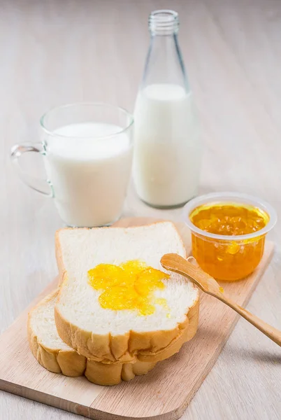 Milk, sliced bread and jam — Stock Photo, Image