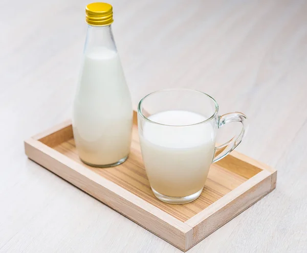 Bottle and glass of milk — Stock Photo, Image