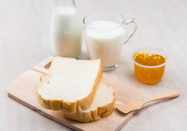 Milk, sliced bread and jam — Stock Photo, Image