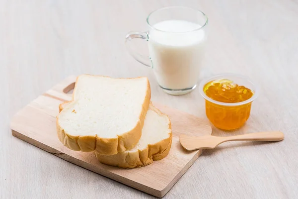 Milk, sliced bread and jam — Stock Photo, Image