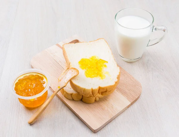 Milk, sliced bread and jam — Stock Photo, Image