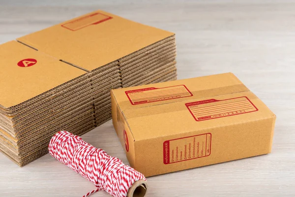 Brown parcel box of thailand on a wooden table