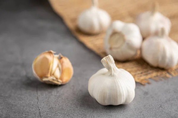 Garlic on the black table. High angle view.